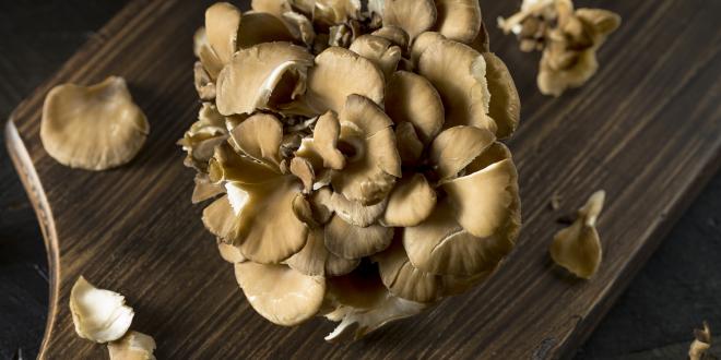 maitake mushroom on a cutting board