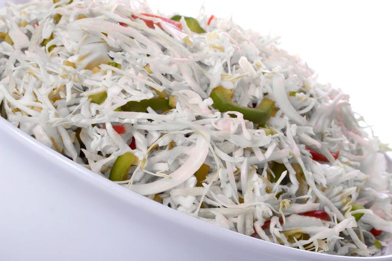 a bowl of shredded cabbage and bell peppers